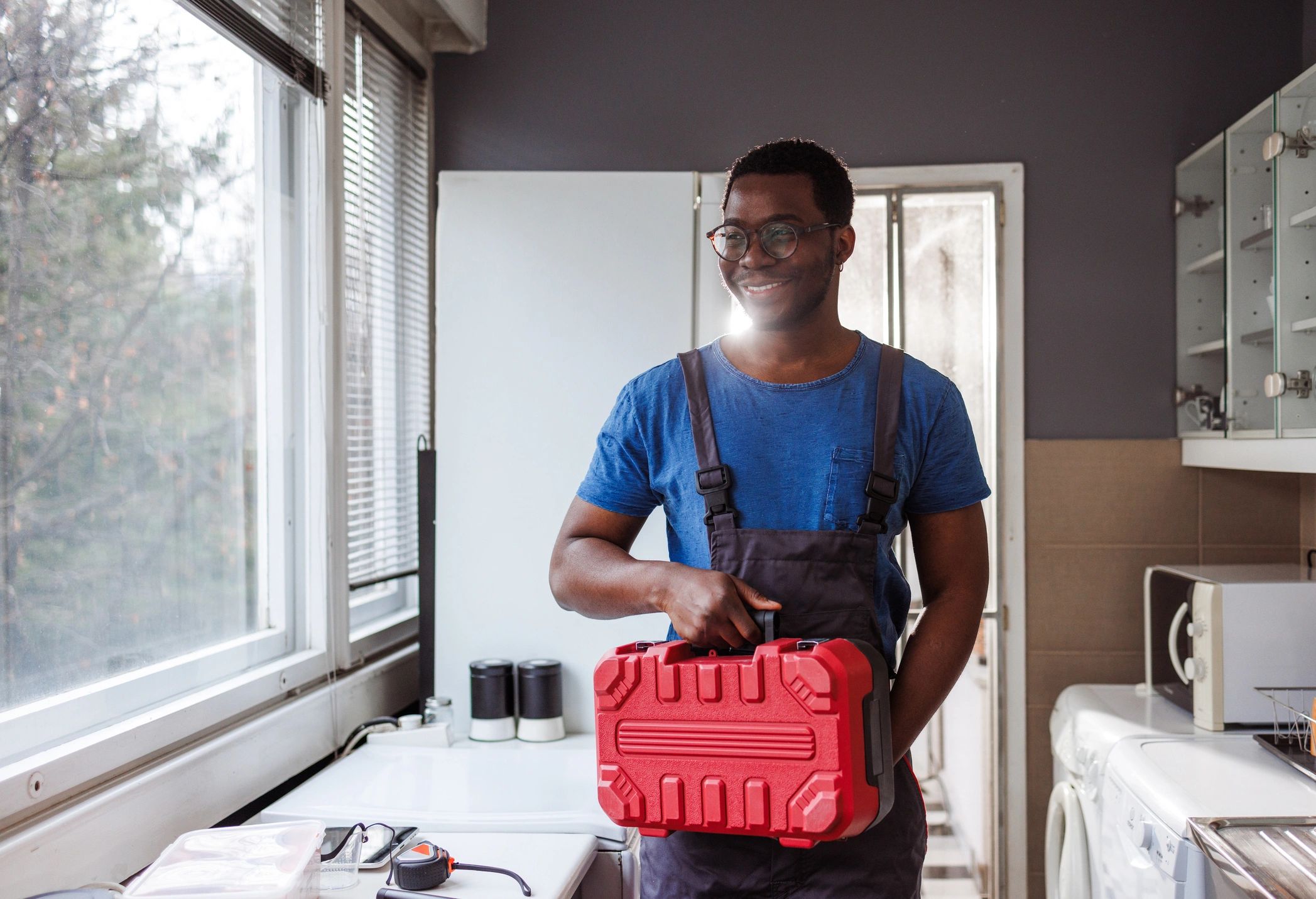 Restoration technician with tools ready for water damage cleanup