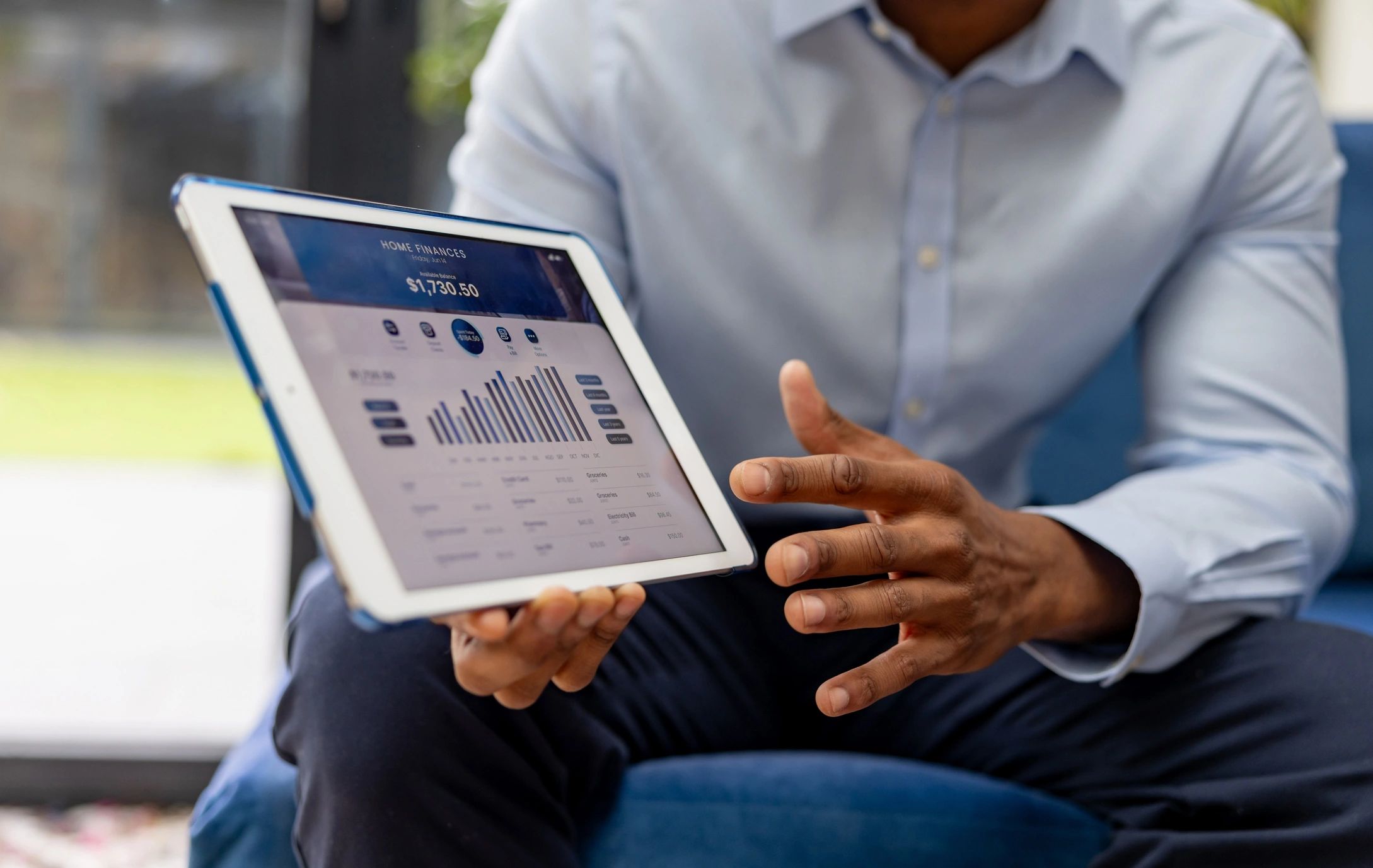 Person reviewing documents on a tablet