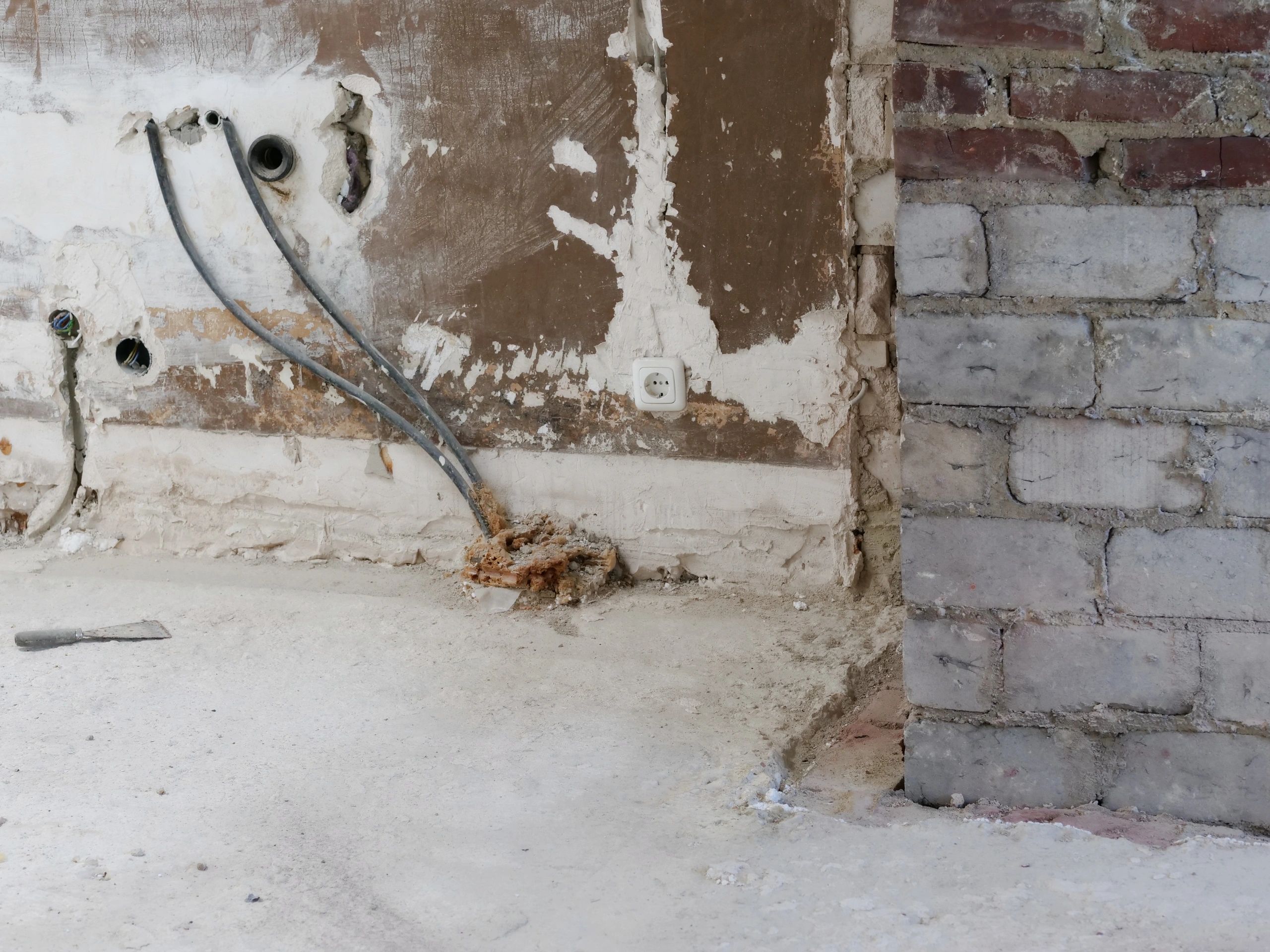 Mold remediation team preparing containment and cleanup inside a home